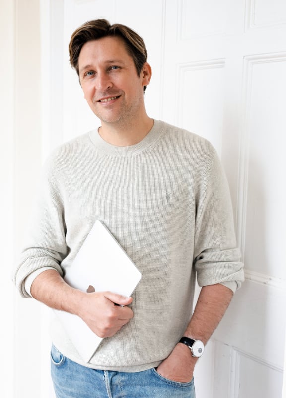 Oliver with his laptop, ready to write your wedding speech