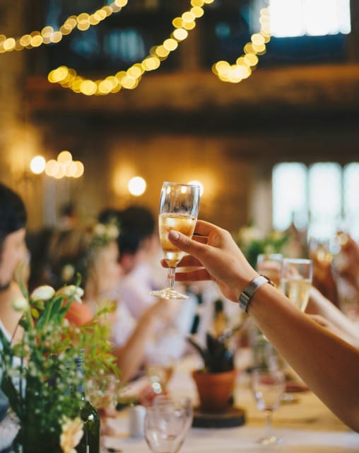 Wedding guests raising a glass